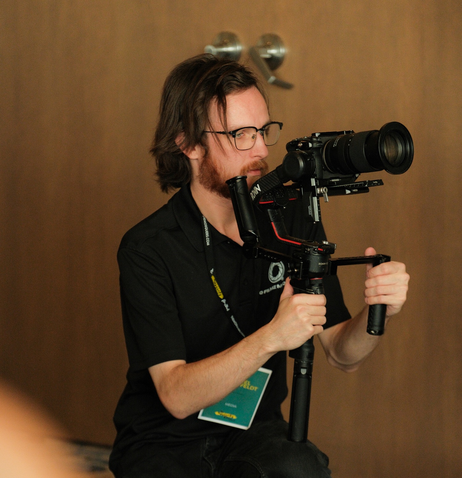 Professional videographer filming at an event in Edmonton, capturing high-quality footage for special occasions. Expert in event videography services tailored to client needs.