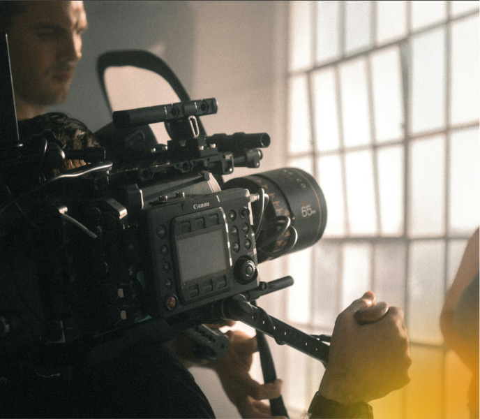 Close-up of a professional video camera used for corporate video production in Edmonton, capturing high-quality footage.