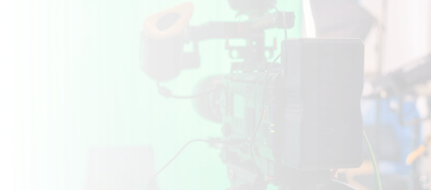 High-quality professional video camera with microphone and monitor in a studio setting for advertising production.